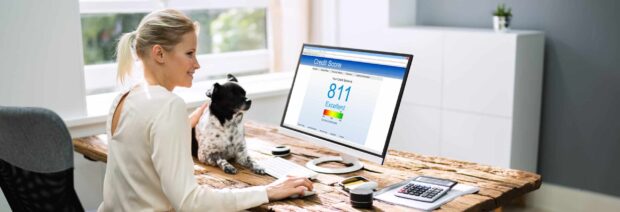 women with dog checking clearscore for creditscore