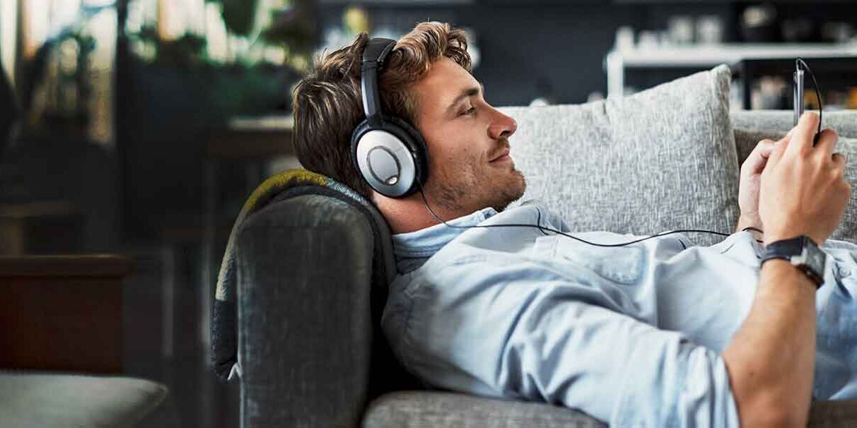 man-sofa-headphones