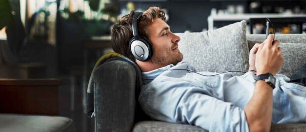 man-sofa-headphones