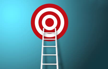 new year goal feature red and white target on blue background, with white ladder reaching up to the target