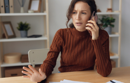 Woman on the phone looking confused