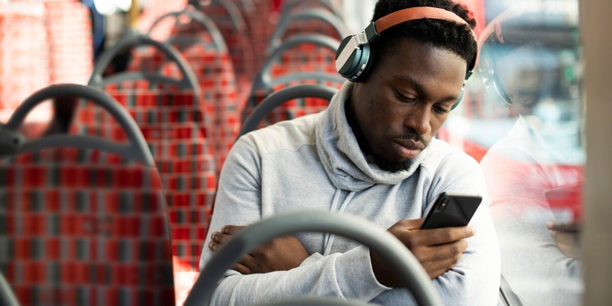 Man on the bus listening to music