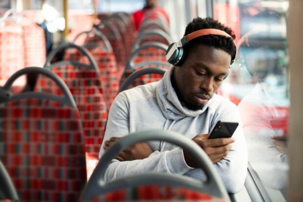 Man on the bus listening to music